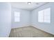 This is a clean bedroom with neutral carpeting and two windows at 3514 S Posse Trl, Gilbert, AZ 85297