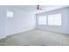 Bedroom with carpet, a ceiling fan, and a window at 3514 S Posse Trl, Gilbert, AZ 85297