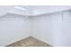 Empty closet with neutral-colored carpet and a top shelf with hanging rods at 3514 S Posse Trl, Gilbert, AZ 85297