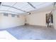 Spacious two car garage with neutral paint, water heater, and epoxy flooring providing clean, sheltered parking and storage at 3514 S Posse Trl, Gilbert, AZ 85297