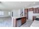 Open concept kitchen featuring stainless steel appliances and adjacent living space at 3514 S Posse Trl, Gilbert, AZ 85297
