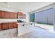 Stylish kitchen with stainless appliances, a kitchen island, and an exterior patio door at 3514 S Posse Trl, Gilbert, AZ 85297