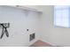 Laundry room with connections and shelving at 3514 S Posse Trl, Gilbert, AZ 85297
