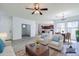Bright living room features neutral tones, open floor plan, and stylish furnishings at 3514 S Posse Trl, Gilbert, AZ 85297