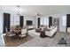 Tastefully decorated living room with dining area featuring virtual staging at 3514 S Posse Trl, Gilbert, AZ 85297