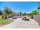 Park seating area with picnic tables, providing a pleasant space for outdoor gatherings and leisure at 3514 S Posse Trl, Gilbert, AZ 85297