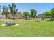 Community park with picnic tables and a volleyball net, perfect for outdoor activities and gatherings at 3514 S Posse Trl, Gilbert, AZ 85297