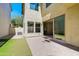 Covered patio features brick flooring and sliding glass doors at 3514 S Posse Trl, Gilbert, AZ 85297