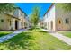 Charming street view with lush green lawns and sidewalks between beautifully designed homes at 3514 S Posse Trl, Gilbert, AZ 85297
