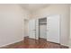 Bedroom features hardwood floors, closet, and a doorway to another room at 371 W Indigo Dr, Chandler, AZ 85248