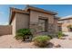 Close-up of desert home highlighting front window and natural rock landscaping at 371 W Indigo Dr, Chandler, AZ 85248