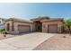 Stunning single-story home with desert landscaping, neutral stucco and stone accents with a two-car garage at 371 W Indigo Dr, Chandler, AZ 85248