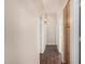 Inviting hallway features dark wood floors and leads to various rooms at 371 W Indigo Dr, Chandler, AZ 85248