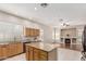 Bright open kitchen with granite countertops, wooden cabinets, and a seamless transition into the living area at 371 W Indigo Dr, Chandler, AZ 85248