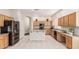Spacious kitchen with light wood cabinets, granite countertops and stainless appliances at 371 W Indigo Dr, Chandler, AZ 85248