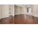 Open living area featuring hardwood floors, neutral paint and an arched entry at 371 W Indigo Dr, Chandler, AZ 85248