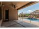 Covered patio offering a shaded retreat with a ceiling fan, overlooking the private pool and backyard at 371 W Indigo Dr, Chandler, AZ 85248