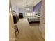 This bedroom features carpet, ceiling fan, window with shutters, and modern light-purple wall paint at 3891 E Simpson Rd, Gilbert, AZ 85297