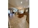 Open-concept kitchen featuring a central island, tile flooring, and stainless steel appliances at 3891 E Simpson Rd, Gilbert, AZ 85297