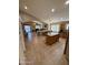 Open concept kitchen with tile flooring, stainless steel appliances, large island, and breakfast bar, providing ample cooking space at 3891 E Simpson Rd, Gilbert, AZ 85297