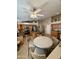 Wide angle shot of a kitchen with granite countertops, stainless steel appliances, and a kitchen table with chairs at 3891 E Simpson Rd, Gilbert, AZ 85297