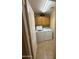 Functional laundry room with a washer, dryer, and upper cabinets for storage at 3891 E Simpson Rd, Gilbert, AZ 85297