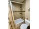 The bathroom includes a tiled shower, shower head, shelf, and toilet at 3891 E Simpson Rd, Gilbert, AZ 85297