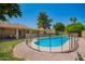 Lush backyard with a sparkling pool, privacy fence, and covered patio for outdoor enjoyment and relaxation at 400 W Crofton St, Chandler, AZ 85225