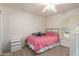 Snug bedroom showcases a bed, shuttered window, neutral carpet and matching dresser at 400 W Crofton St, Chandler, AZ 85225