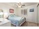 Cozy bedroom featuring carpet floors, shuttered windows and a ceiling fan for optimal climate control at 400 W Crofton St, Chandler, AZ 85225