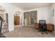 Bonus room with a desk, sliding glass doors to the outside, and a view into the main bedroom at 400 W Crofton St, Chandler, AZ 85225