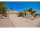 Attractive single-story home with an attached garage, a wide driveway, and colorful plants adding visual interest at 400 W Crofton St, Chandler, AZ 85225