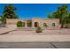 Charming single-story home featuring a well-manicured landscape and a welcoming entrance, showcasing curb appeal at 400 W Crofton St, Chandler, AZ 85225