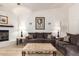 Cozy living room with a fireplace and ample seating area with two sofas at 400 W Crofton St, Chandler, AZ 85225