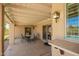 Inviting covered patio with tiled bar and seamless transition to the sparkling pool, perfect for relaxing outdoors at 400 W Crofton St, Chandler, AZ 85225