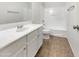 Bathroom featuring a single sink vanity, framed mirror, and a shower-tub combo at 4229 E Betsy Ln, Gilbert, AZ 85296