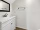 Powder room featuring a modern vanity with a sink and a minimalist design at 4229 E Betsy Ln, Gilbert, AZ 85296