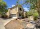 Two-story home featuring a front-facing two car garage, low-maintenance landscaping, and an inviting front porch at 4229 E Betsy Ln, Gilbert, AZ 85296