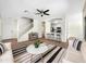 Bright living room featuring wood floors, modern furnishings, ceiling fan, and an open concept kitchen at 4229 E Betsy Ln, Gilbert, AZ 85296