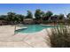 Inviting community pool area featuring turquoise water, a pool house, and ample space for relaxation under the sun at 4229 E Betsy Ln, Gilbert, AZ 85296