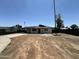 Street view of a newly renovated single-story home with a carport and desert landscaping at 4425 W Sierra St, Glendale, AZ 85304