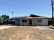 Charming single-story home featuring a covered carport, solar panels, and a freshly landscaped front yard at 4425 W Sierra St, Glendale, AZ 85304