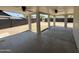 Large covered patio with concrete flooring and two ceiling fans at 4425 W Sierra St, Glendale, AZ 85304