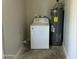 Utility room with washing machine and water heater at 4425 W Sierra St, Glendale, AZ 85304