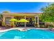 Expansive backyard showcasing a pristine pool, shaded patio, and well-manicured landscaping for serene outdoor living at 4511 E Kirkland Rd, Phoenix, AZ 85050
