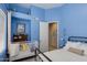 Bedroom with a baby crib and decoratively mounted keys on the wall at 4511 E Kirkland Rd, Phoenix, AZ 85050