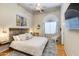Cozy bedroom with a ceiling fan, a rustic headboard, and a rocking chair at 4511 E Kirkland Rd, Phoenix, AZ 85050