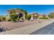 Well-maintained front yard with desert landscaping and a view of neighboring homes in a suburban setting at 4511 E Kirkland Rd, Phoenix, AZ 85050