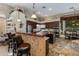 This kitchen features brown cabinets, tile flooring, bar seating, stainless steel appliances, and a dining nook at 4511 E Kirkland Rd, Phoenix, AZ 85050