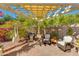 Charming outdoor patio area with a pergola, grill, and cozy seating, perfect for enjoying sunny days at 4511 E Kirkland Rd, Phoenix, AZ 85050